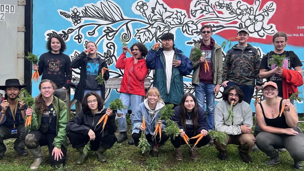 APU Students in front of a land acknowledgement mural by artist Melissa Shaginoff